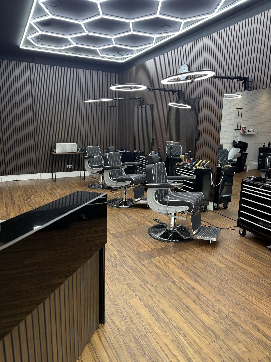 Inside HeadsUp Barbers, Fradley — barber chairs under the hexagon light ceiling